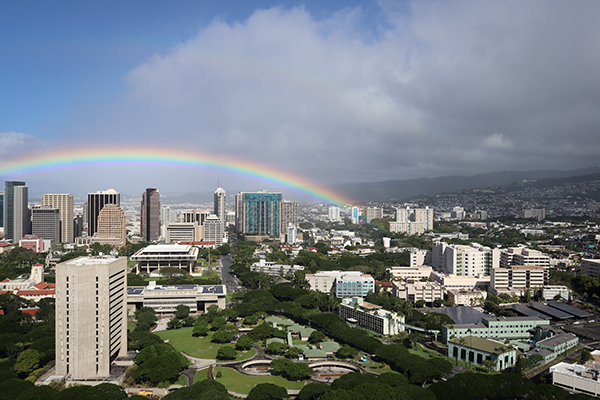 Rainbow behind buildings